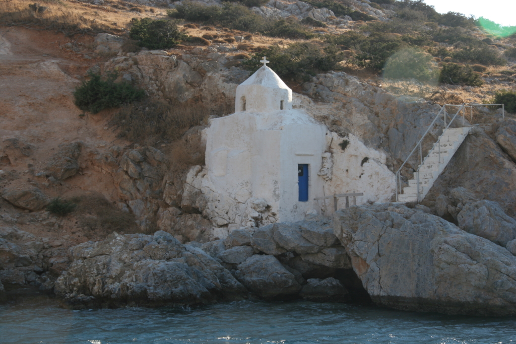 discover small Cycladic chapels “hanging” from cliffs